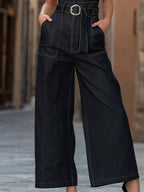 Tuta intera in denim a gamba larga con scollo a V profondo e cintura